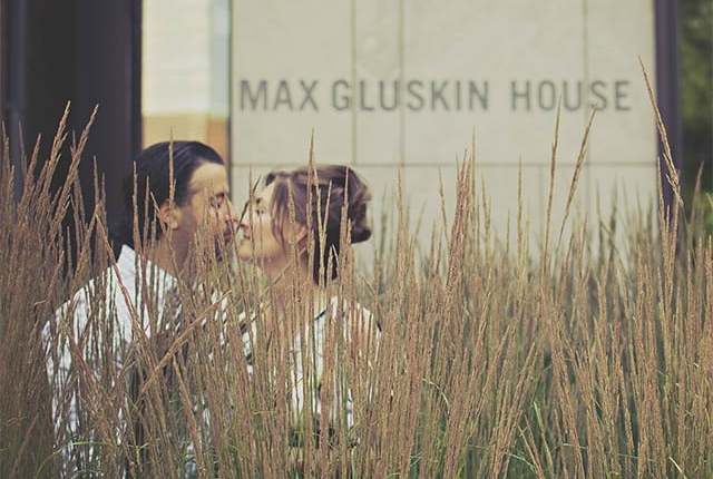 Couple about to kiss outside of bulding