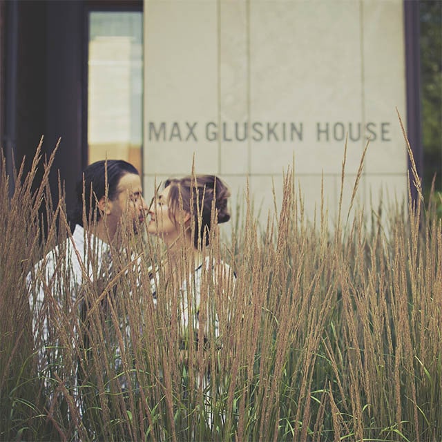 Couple about to kiss outside of bulding