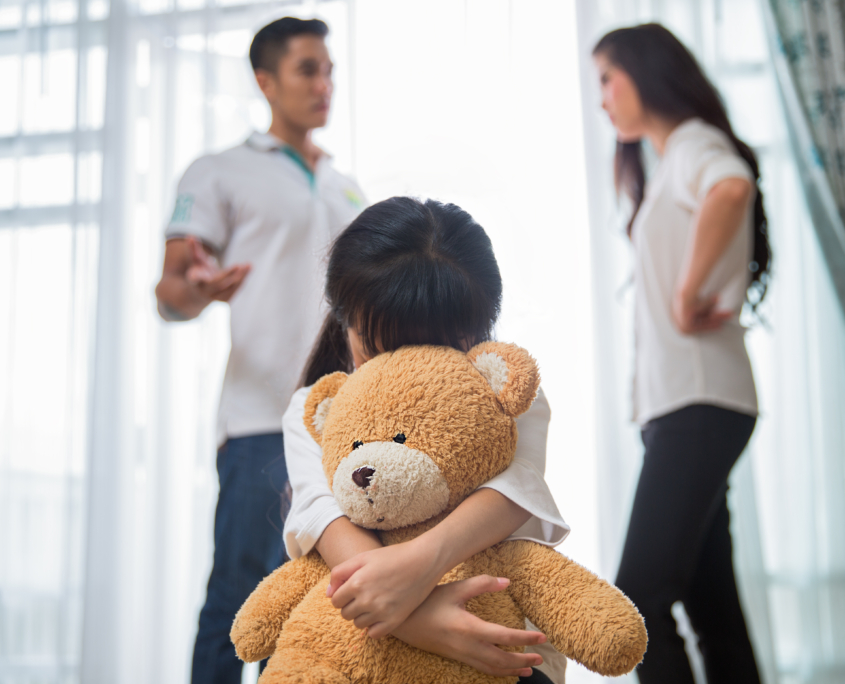 Sad child from this father and mother arguing, family negative concept.