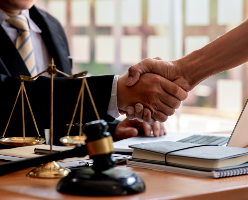 The Lawyer is currently shaking hands with the client about the